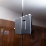 Close-up of the Dundalk Nook sauna 10mm glass door and handle