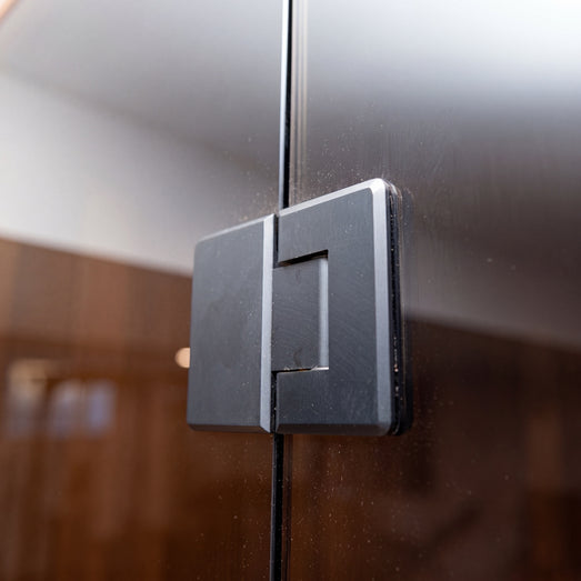 Close-up of the Dundalk Nook sauna 10mm glass door and handle