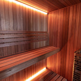 Dundalk Studio sauna interior showing the electric heater and water bucket
