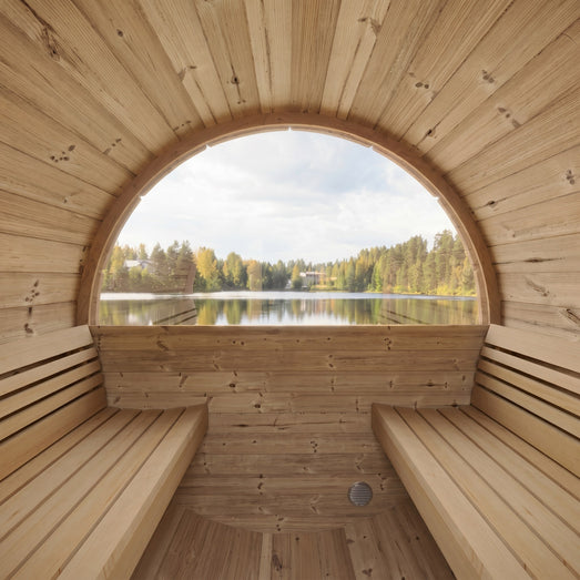 SaunaLife E8 barrel sauna interior with cedar benches and panoramic lakeside window
