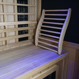 Finnmark cedar backrest resting on a sauna bench beside infrared heater panels