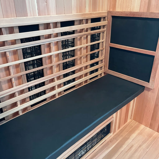 Finnmark FD-3 cushion fitted along a cedar sauna bench beside infrared heaters