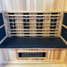 Close view of Finnmark FD-3 black cushion against light cedar sauna paneling