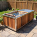 Finnmark SoulCold cold plunge tub filled with water on a backyard stone patio