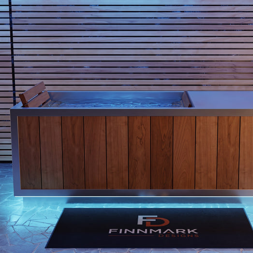 Front view of the Finnmark SoulCold plunge tub glowing under blue LED lighting