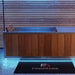 Front view of the Finnmark SoulCold plunge tub glowing under blue LED lighting