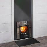 Close detail of the Harvia PRO 36 DUO wood-burning sauna stove in low light