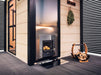 Harvia PRO 36 DUO wood-burning stove installed in a warm sauna room setting