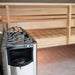 Angled corner view of the Harvia The Wall heater and its dial inside a sauna