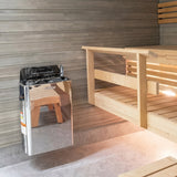 Stainless Harvia The Wall heater installed in a light sauna with wooden benches