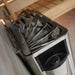 Overhead view of the Harvia The Wall heater stones and dial in a wooden sauna