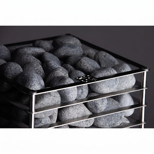 HUUM CLIFF 10.5kW heater top corner with dark grey stones on dark backdrop