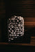 HUUM CLIFF 10.5kW stone heater lit dramatically in a dark wooden sauna