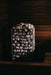 HUUM Cliff sauna heater lit dramatically against dark wooden sauna walls