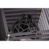 HUUM emblem on the steel grille of the Cliff 6kW sauna heater up close