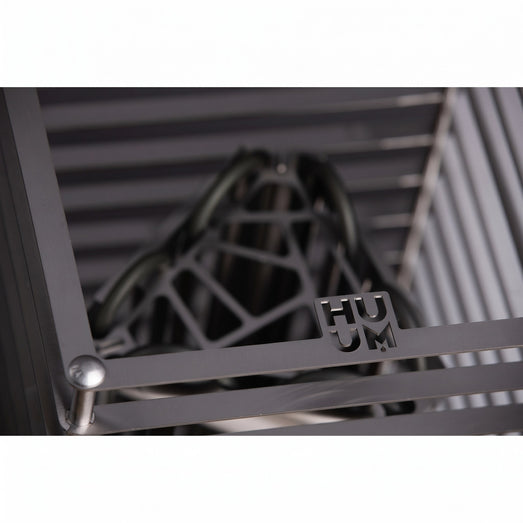 HUUM emblem on the steel grille of the Cliff 6kW sauna heater up close