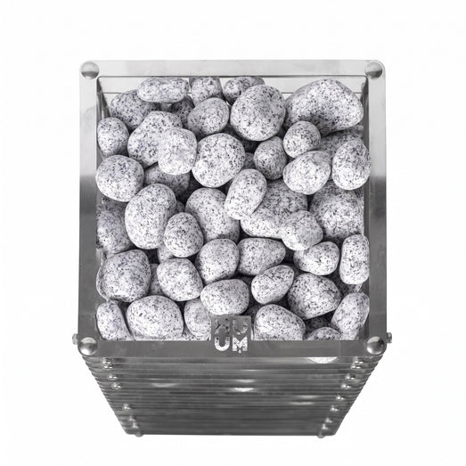 Speckled granite stones filling the top of the HUUM Cliff sauna heater