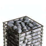Top-down view of dark sauna stones loaded in the HUUM Cliff heater basket