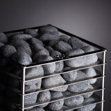 HUUM CLIFF 9kW heater angled view of dark grey stones against charcoal backdrop
