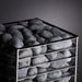 HUUM CLIFF 9kW heater angled view of dark grey stones against charcoal backdrop