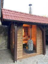 HUUM chimney kit installed on outdoor cabin sauna exterior with stove inside