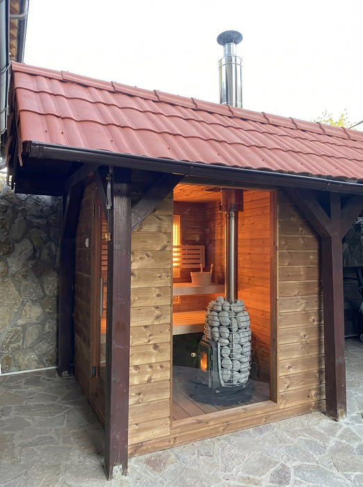 HUUM chimney kit installed on outdoor cabin sauna exterior with stove inside