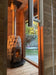 HUUM chimney rising from stone-clad wood stove inside cedar sauna interior