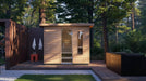 Kohler C2 outdoor sauna on a deck beside an outdoor shower and cold plunge
