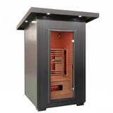 Angled view of the Logan 200D6 gray paneled outdoor infrared sauna cabin