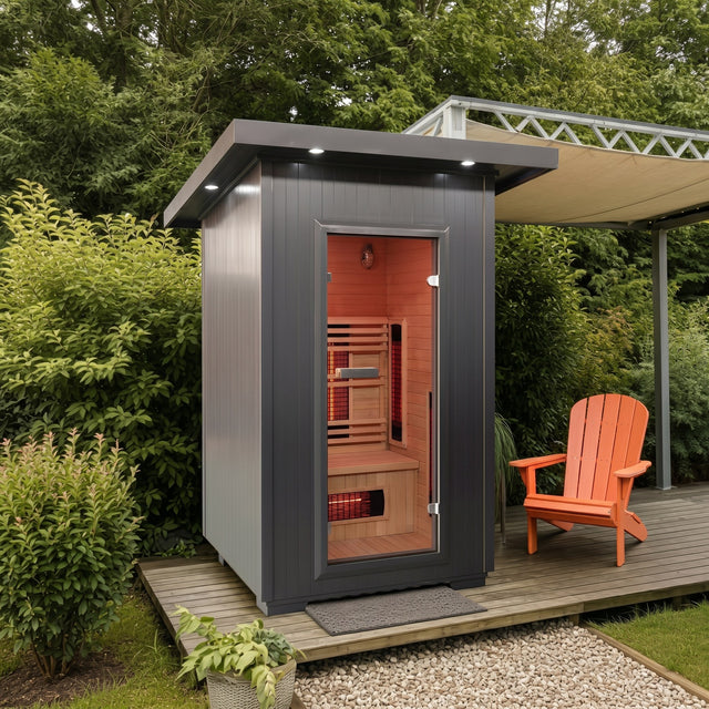 Logan 200D6 two person outdoor infrared sauna on a deck beside an orange chair