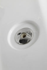 Detail of a chrome whirlpool jet fitting set into the white Mesa 807A tub