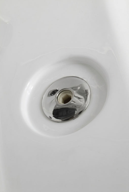 Detail of a chrome whirlpool jet fitting set into the white Mesa 807A tub