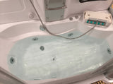 Mesa 807A whirlpool tub filled with water showing chrome jets and headrest