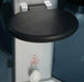 Mesa 9090 steam shower folding seat above a Caution Hot Surface warning label