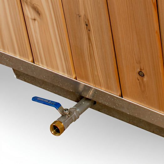 Close-up of the Polar Cold Plunge Tub drain ball valve beneath the cedar side panels