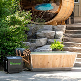 Polar Cold Plunge Tub and Leisurecraft chiller in a landscaped backyard beside a barrel sauna