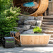 Polar Cold Plunge Tub and Leisurecraft chiller in a landscaped backyard beside a barrel sauna