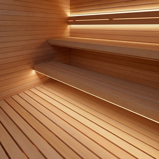 ProSaunas LED strips lighting the backrest and bench edges of a stepped light-wood sauna