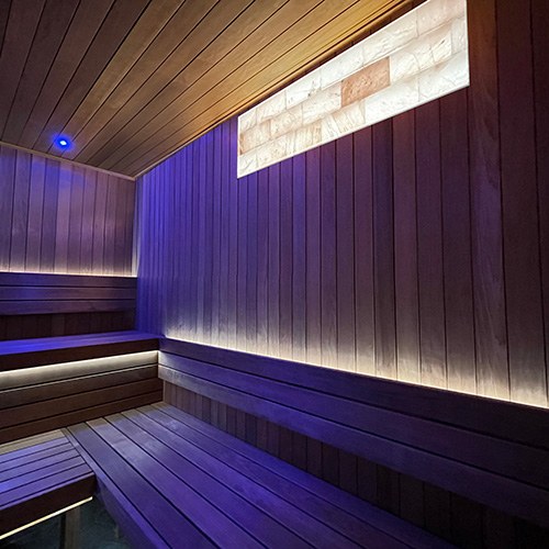 ProSaunas Universal Himalayan Salt Sauna Light Kit, 12 x 48 in: three rows of back-lit pink salt bricks recessed above sauna benches