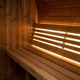 SaunaLife E6 sauna bench with warm LED accent lighting behind the backrest