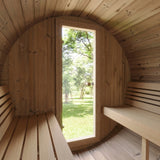 SaunaLife E6 sauna interior looking out the open door to a green lawn