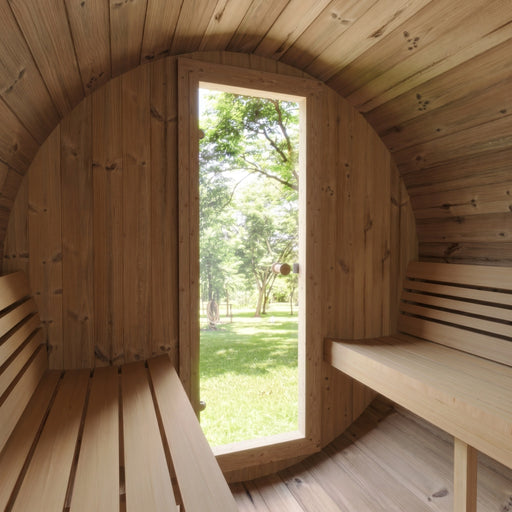 SaunaLife E6 sauna interior looking out the open door to a green lawn