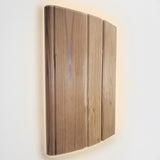 SaunaLife E6 curved wooden sconce light shade shown front-on against wall