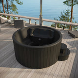 SaunaLife S4 black hot tub overhead view showing molded interior seating on a sea-view deck