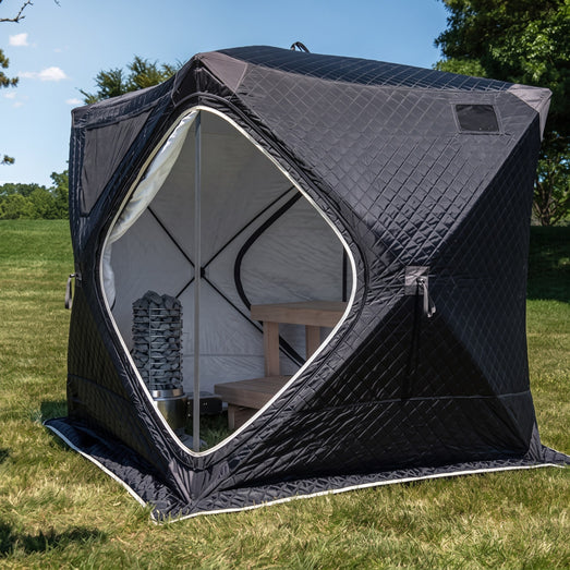 SaunaLife Titan SL1 inside a black SaunaTrekker portable sauna tent on a lawn