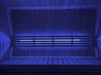 SaunaLife X7MOOD LED lighting glowing blue across a wood sauna bench