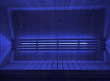 SaunaLife X7MOOD LED lighting glowing blue across a wood sauna bench