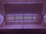 SaunaLife X7MOOD LED lighting in magenta illuminating a sauna interior