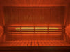 SaunaLife X7MOOD LED lighting glowing warm orange across a cedar sauna bench