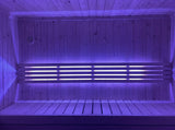 SaunaLife X7MOOD LED bar lighting a sauna in cool purple tones
